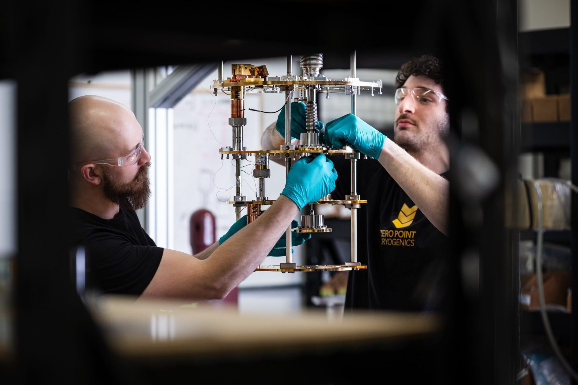 Technicians installing a dilution unit into a Model L dilution refrigerator built by Zero Point Cryogenics